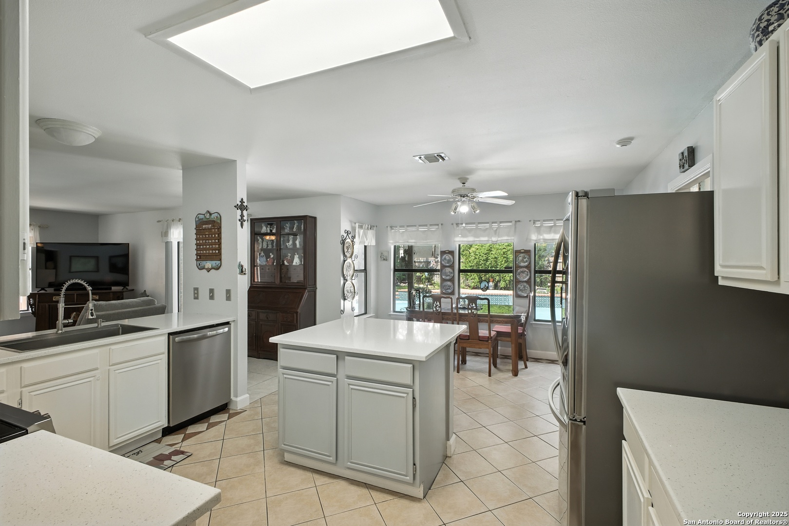 16414 Bulverde Point San Antonio, TX 78247 - Photo 18 of 46 a kitchen with a sink appliances and dining table