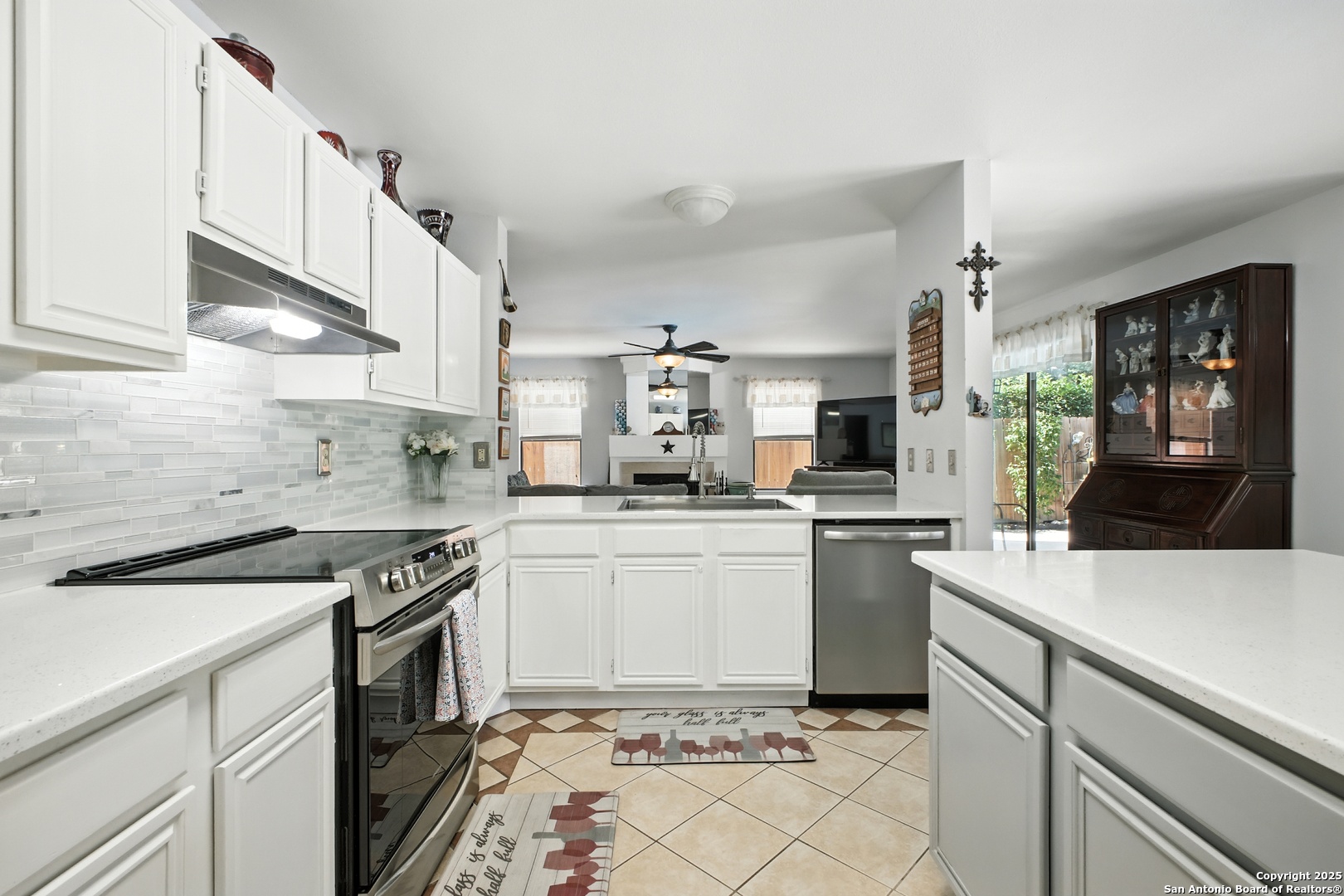 16414 Bulverde Point San Antonio, TX 78247 - Photo 19 of 46 a kitchen with a sink cabinets and appliances