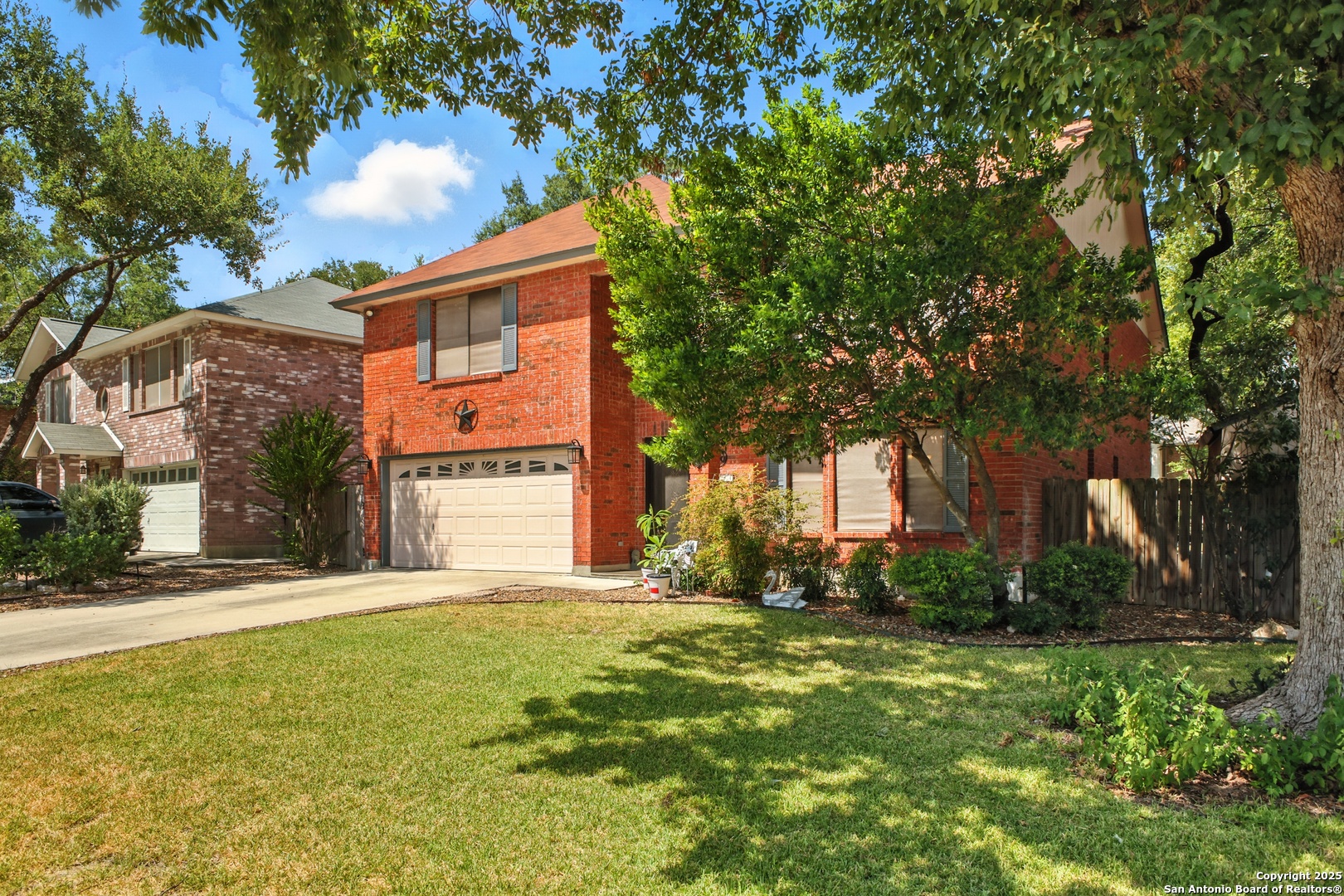 16414 Bulverde Point San Antonio, TX 78247 - Photo 2 of 46 a front view of house with yard and trees