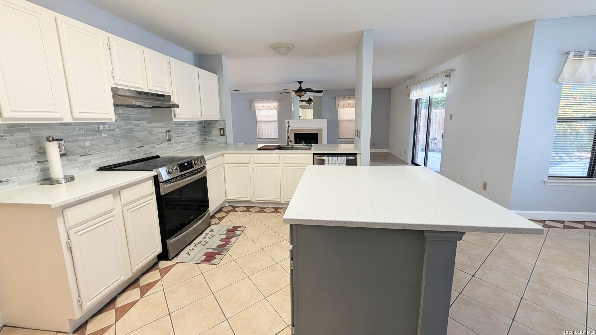16414 Bulverde Point San Antonio, TX 78247 - Photo 21 of 46 a kitchen with a stove a sink and a refrigerator
