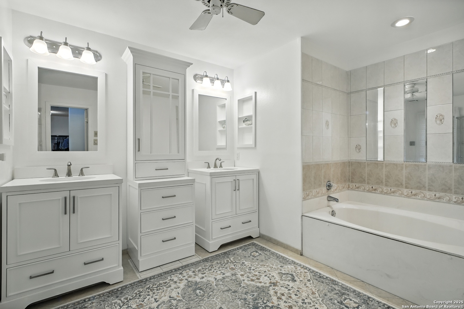 16414 Bulverde Point San Antonio, TX 78247 - Photo 26 of 46 a bathroom with a double vanity sink mirror and bathtub