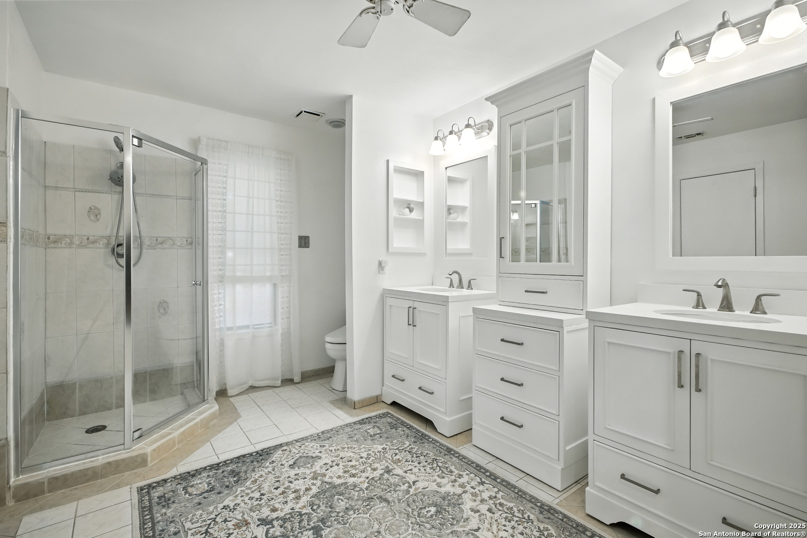 16414 Bulverde Point San Antonio, TX 78247 - Photo 27 of 46 a spacious bathroom with double sink shower and mirror