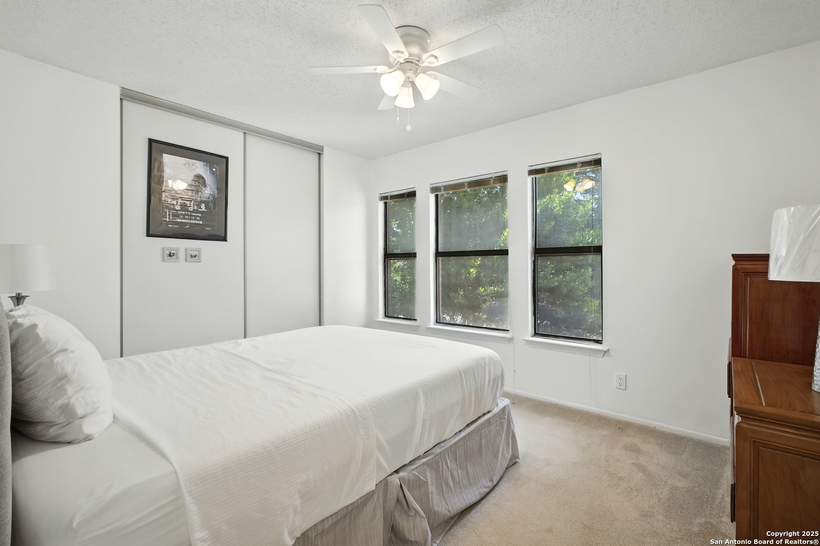 16414 Bulverde Point San Antonio, TX 78247 - Photo 29 of 46 a bedroom with a large bed and a window