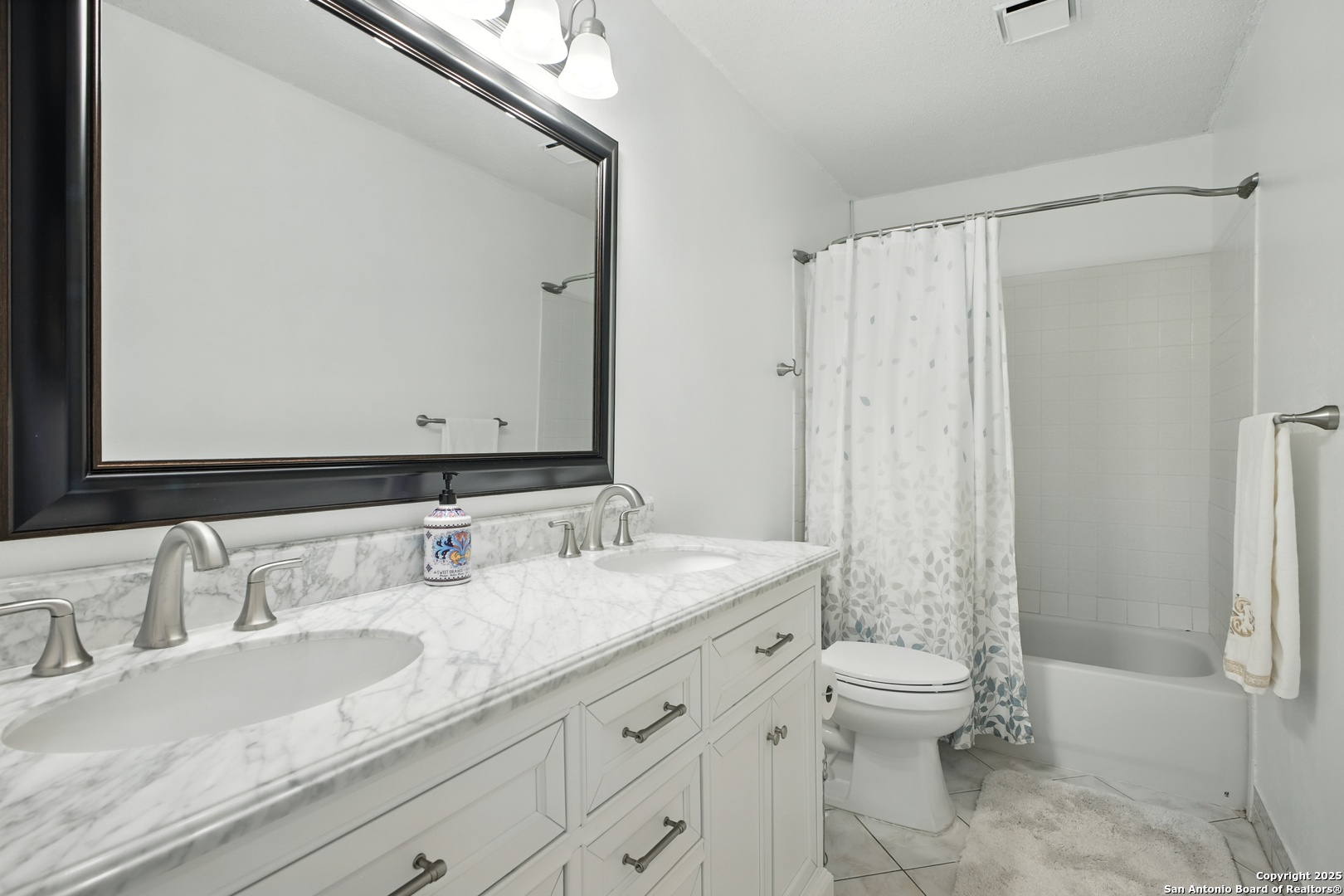 16414 Bulverde Point San Antonio, TX 78247 - Photo 30 of 46 a bathroom with a granite countertop sink toilet and shower