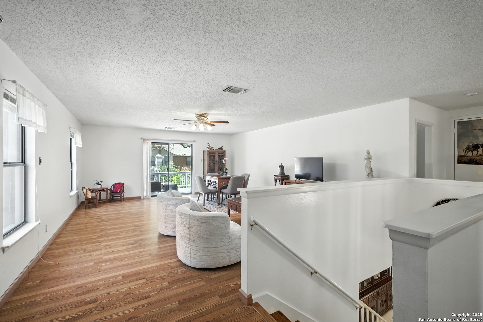 16414 Bulverde Point San Antonio, TX 78247 - Photo 32 of 46 a living room with furniture and a wooden floor