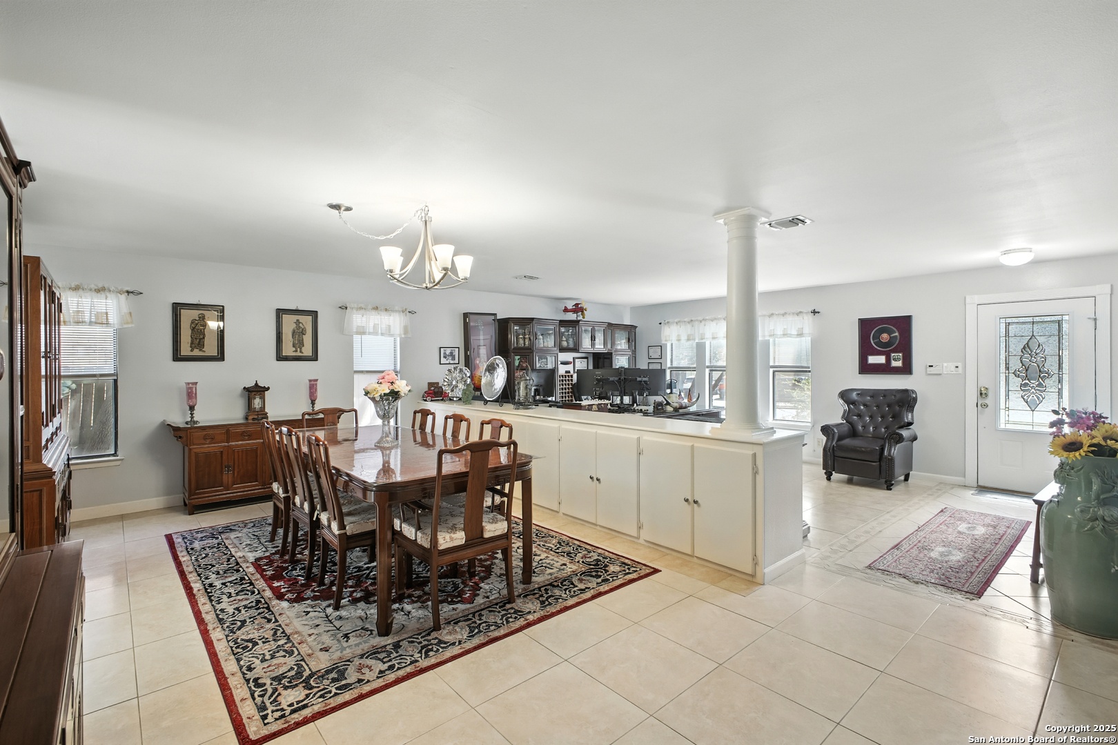 16414 Bulverde Point San Antonio, TX 78247 - Photo 5 of 46 a large kitchen with a table and chairs