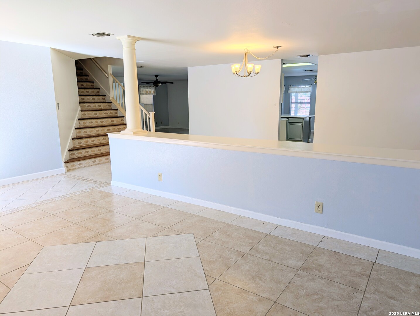 16414 Bulverde Point San Antonio, TX 78247 - Photo 6 of 46 a view of an empty room with wooden floor and a window