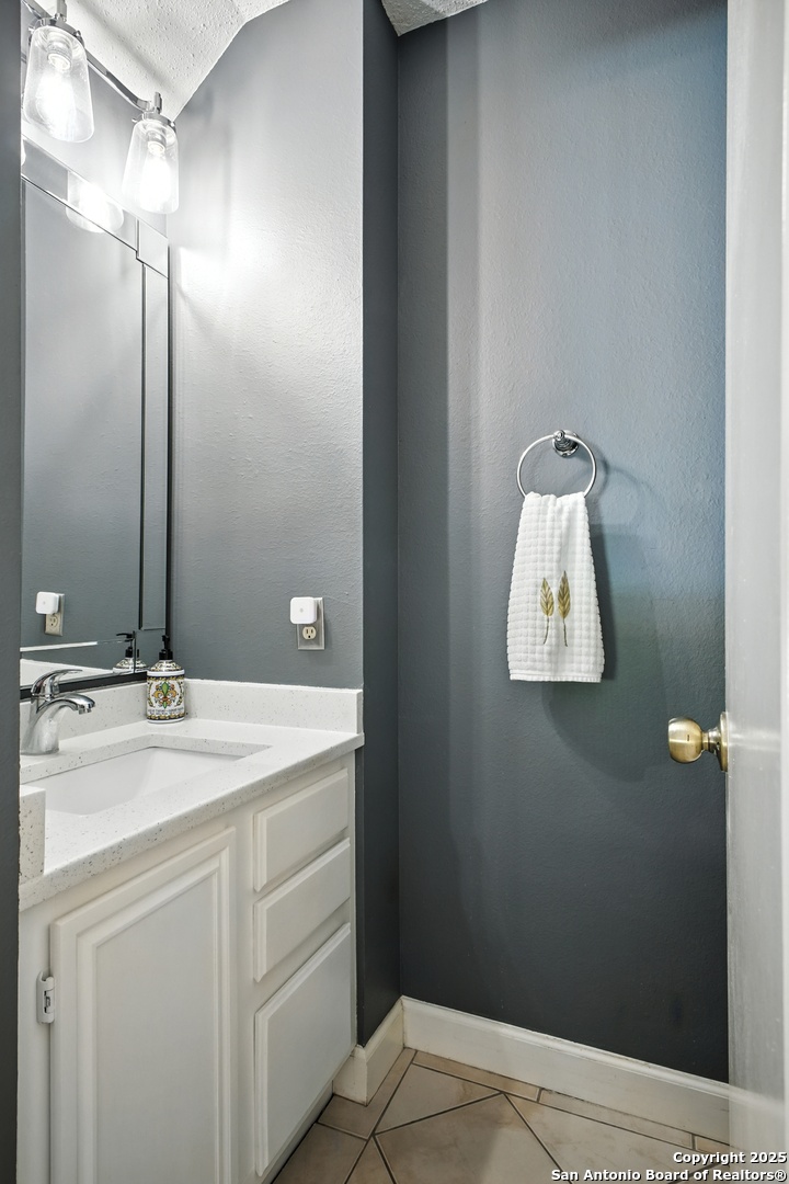 16414 Bulverde Point San Antonio, TX 78247 - Photo 8 of 46 a bathroom with a sink and mirror