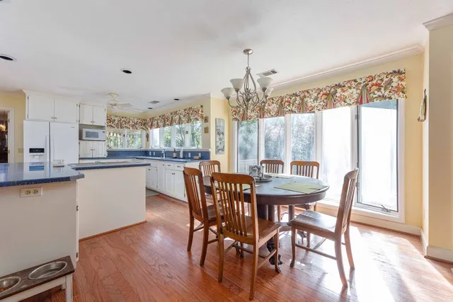 a front view of a house with plants