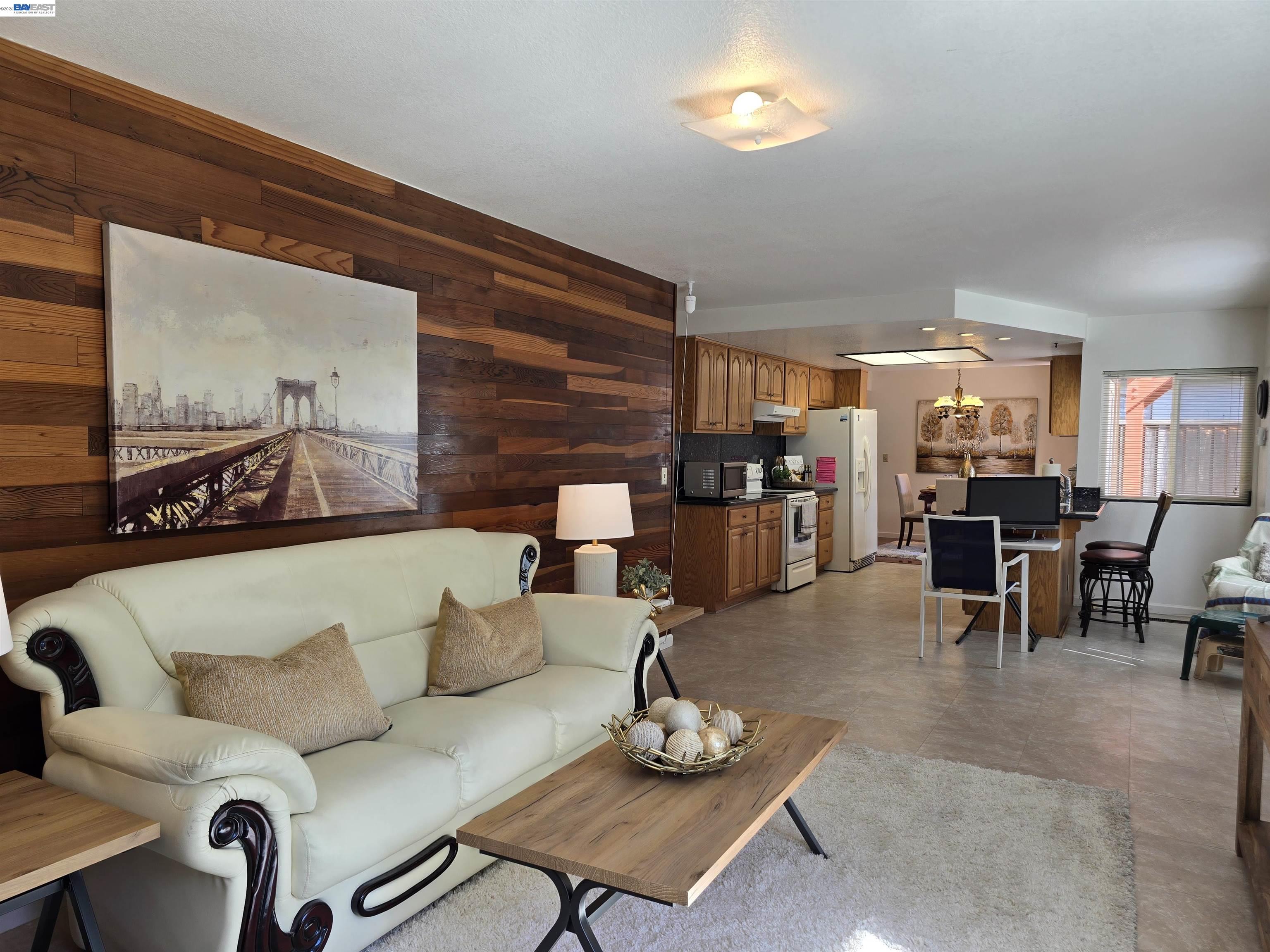 161 Hackamore Lane Fremont, CA 94539 - Photo 28 of 60 a living room with furniture kitchen view and a large window