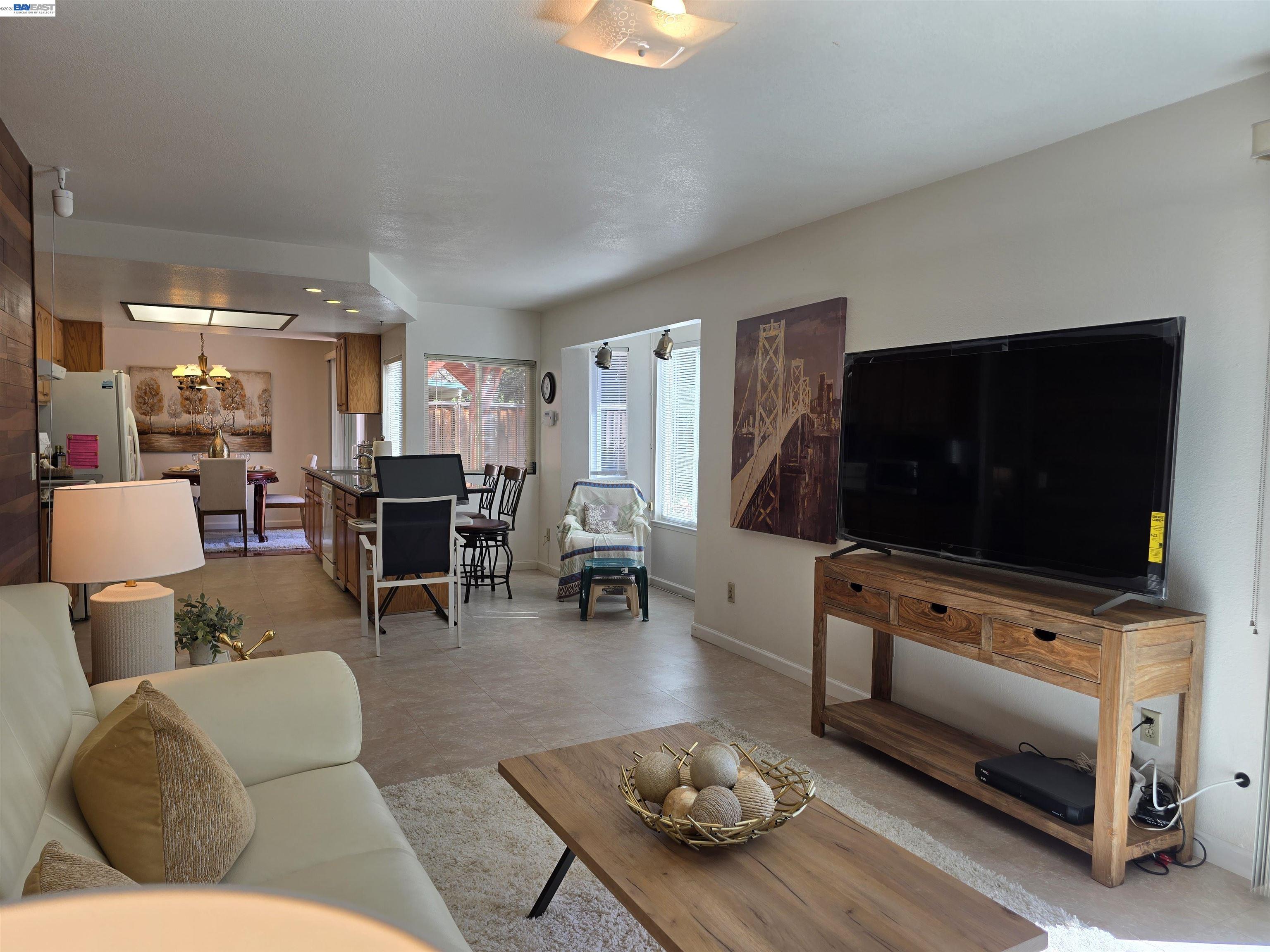161 Hackamore Lane Fremont, CA 94539 - Photo 29 of 60 a living room with furniture and a flat screen tv