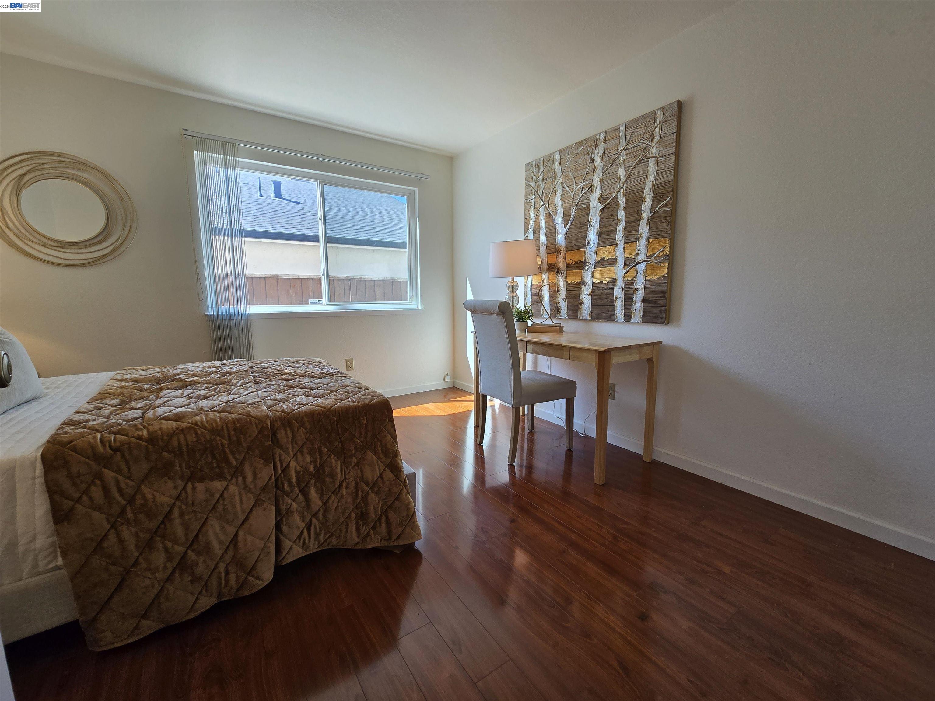 161 Hackamore Lane Fremont, CA 94539 - Photo 33 of 60 a bed sitting in a bedroom next to a window