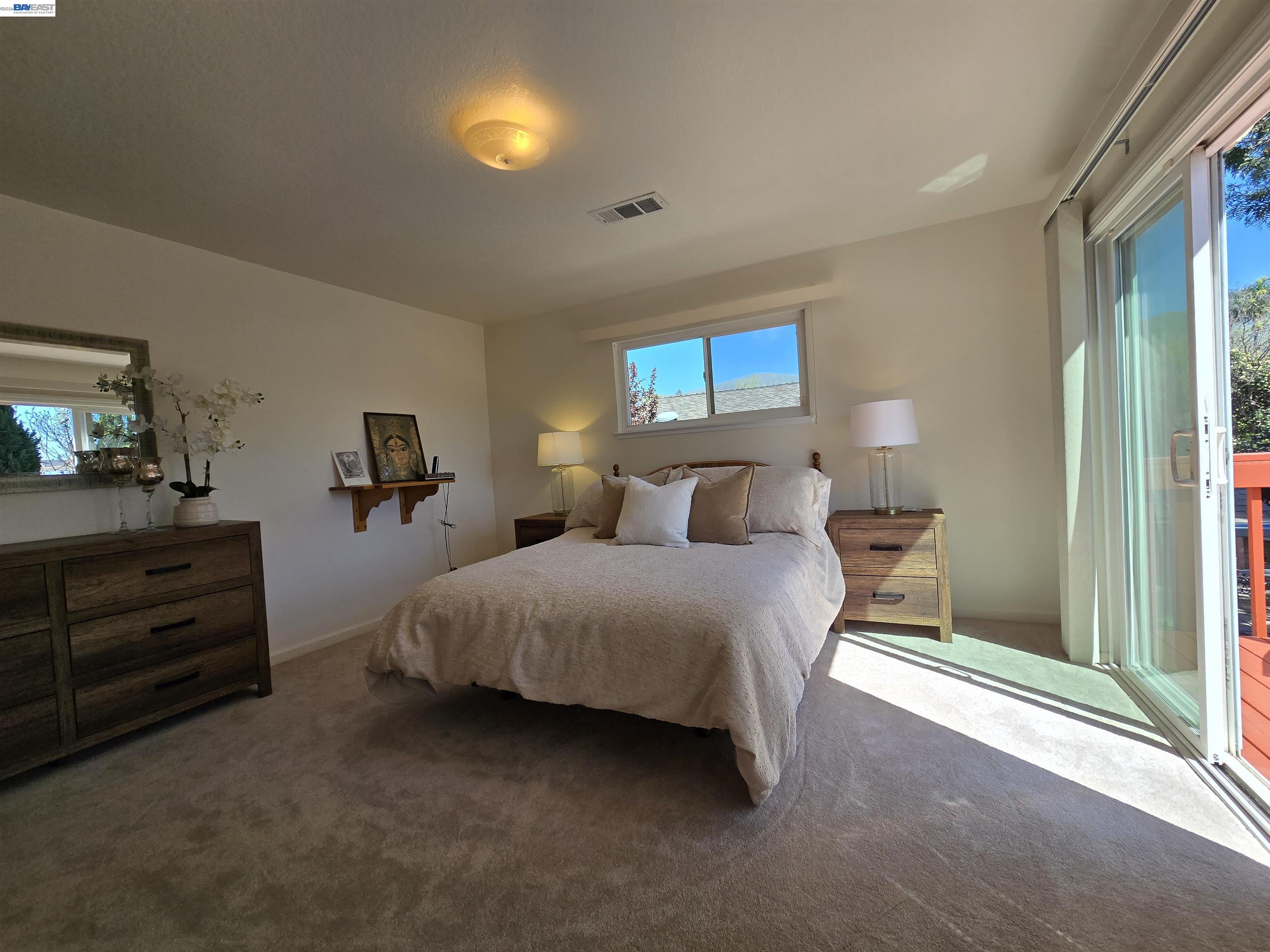161 Hackamore Lane Fremont, CA 94539 - Photo 39 of 60 a bedroom with bed and a night stand