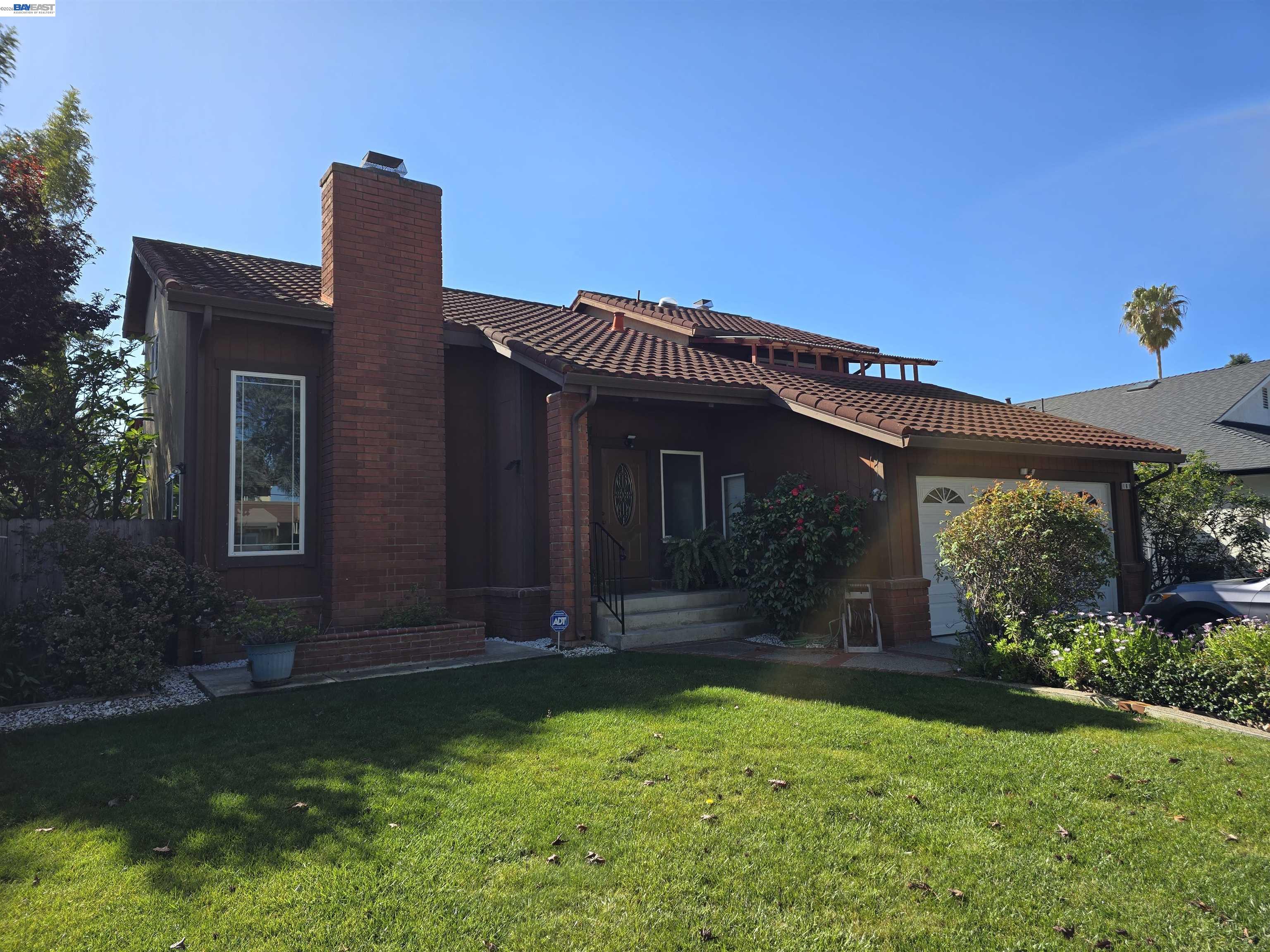 161 Hackamore Lane Fremont, CA 94539 - Photo 4 of 60 a front view of a house with garden