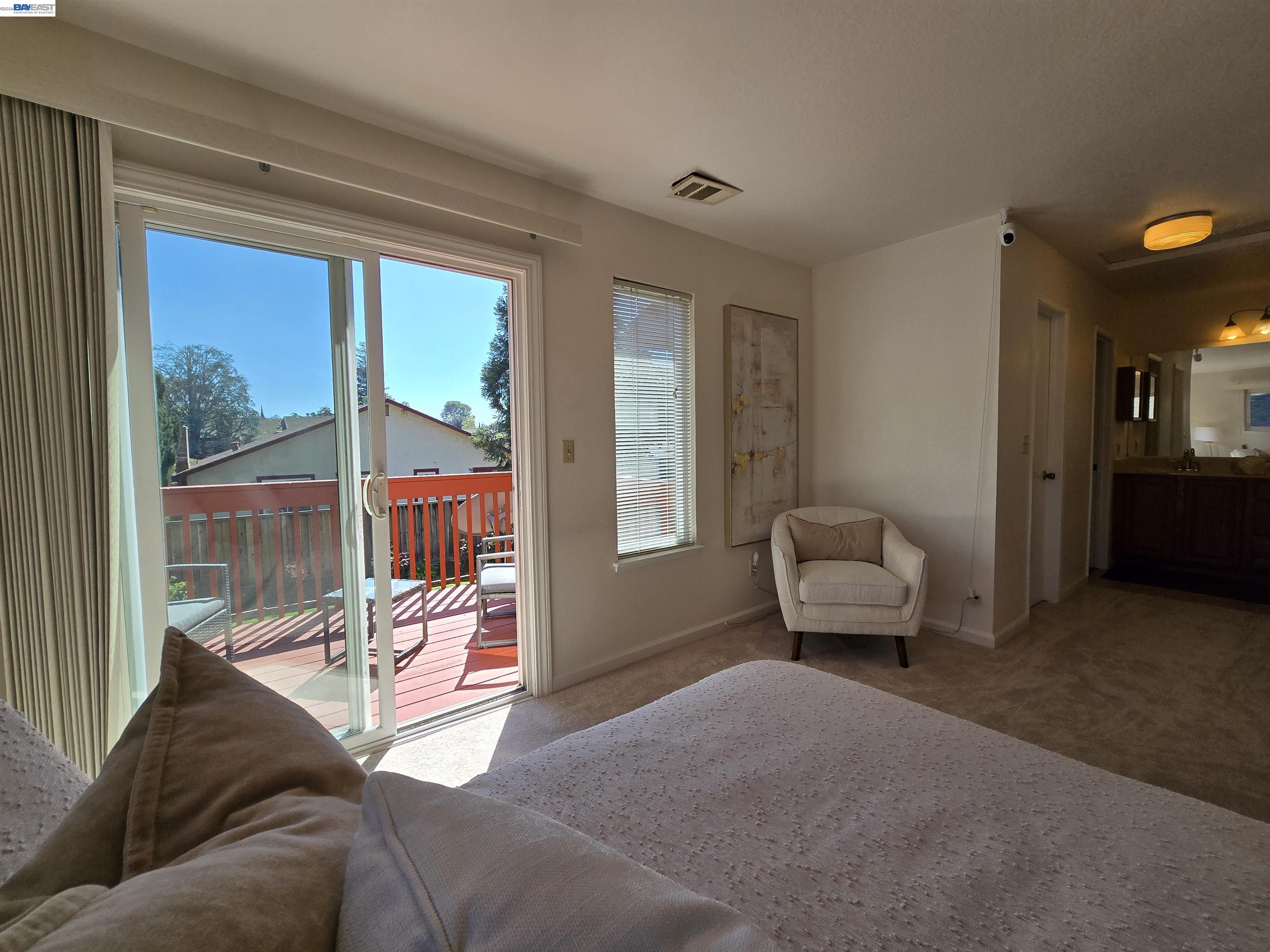161 Hackamore Lane Fremont, CA 94539 - Photo 42 of 60 a living room with furniture and a floor to ceiling window