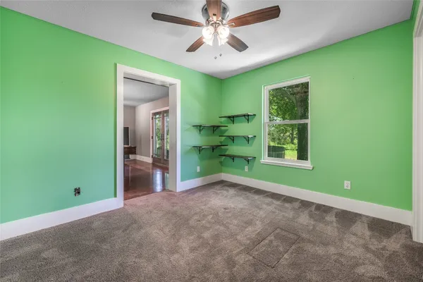 a view of a room with window front door