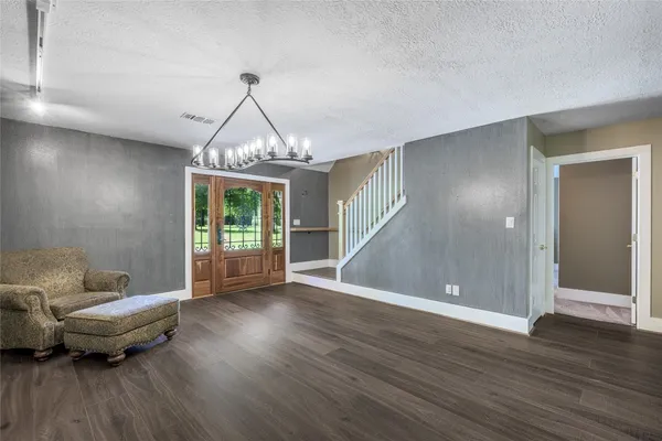a view of livingroom with furniture wooden floor and windows