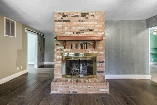 a view of fireplace and wooden floor