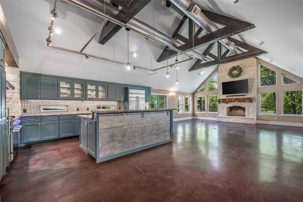 a view of a kitchen with a stove cabinets and a wooden floor