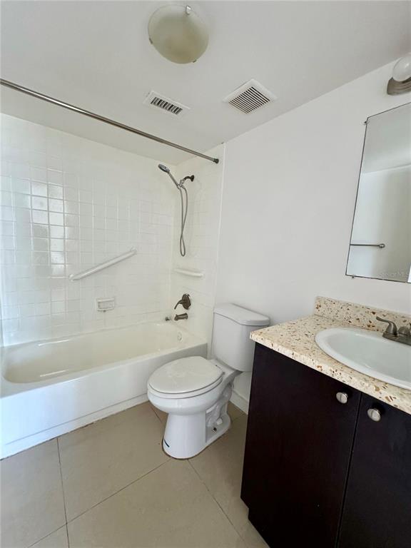 13300 Walsingham Road, Unit 26 Largo, FL 33774 - Photo 11 of 22 a bathroom with a sink toilet a mirror and shower
