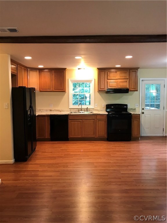 6904 Full Rack Court Midlothian, VA 23112 - Photo 12 of 29 a view of kitchen with stainless steel appliances wooden floor and large window