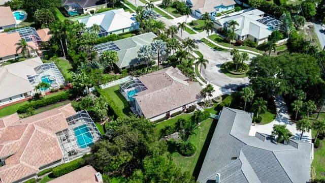 an aerial view of residential house with outdoor space and street view