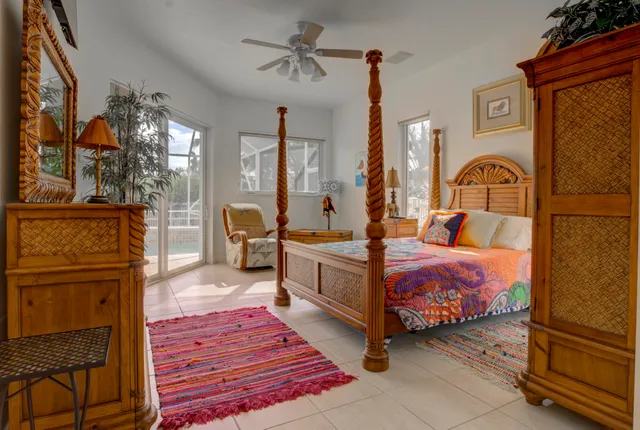 a living room with fireplace furniture and a large window
