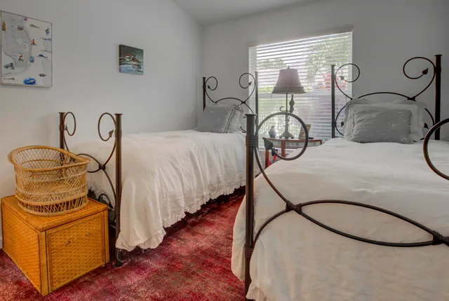 a living room with furniture a rug and a window