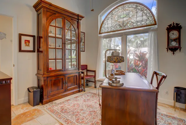 a view of a patio with a table and chairs