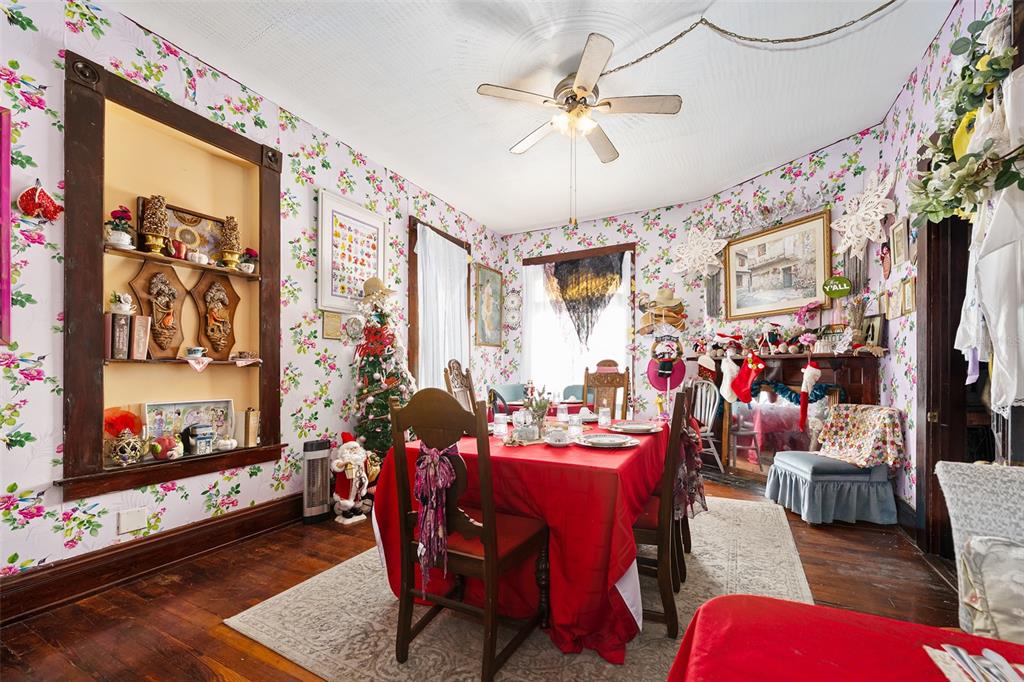 228 West Howry Avenue Deland, FL 32720 - Photo 14 of 51 a living room with furniture and a flat screen tv