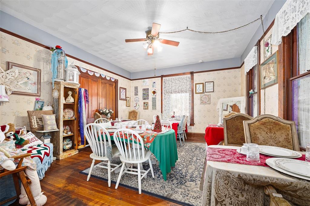 228 West Howry Avenue Deland, FL 32720 - Photo 15 of 51 a living room with furniture and a large window