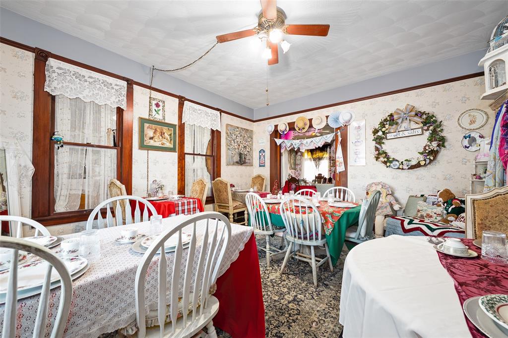 228 West Howry Avenue Deland, FL 32720 - Photo 16 of 51 a bedroom with furniture and a large window