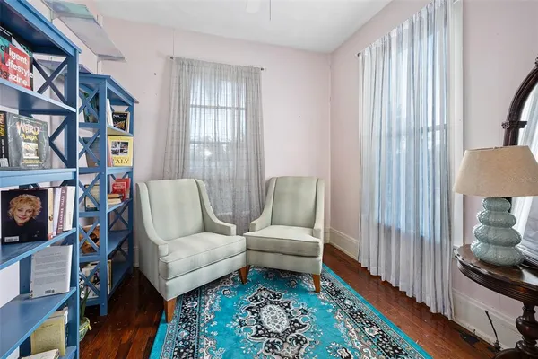 a living room with furniture and a rug
