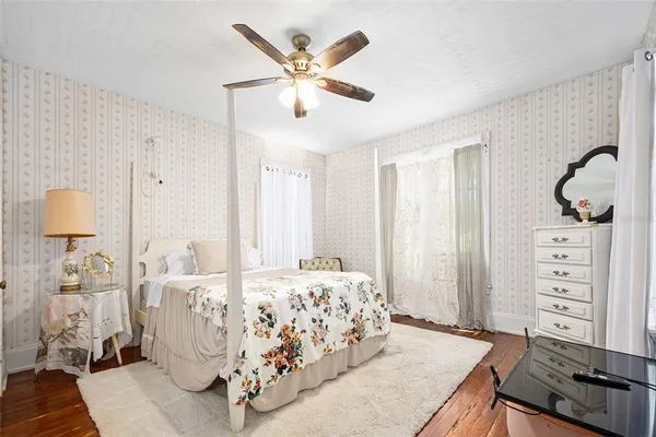 a bedroom with a bed and a couch