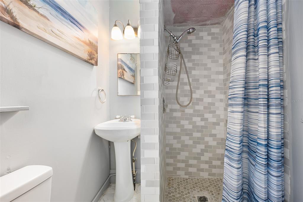 228 West Howry Avenue Deland, FL 32720 - Photo 29 of 51 a bathroom with a sink a toilet and shower