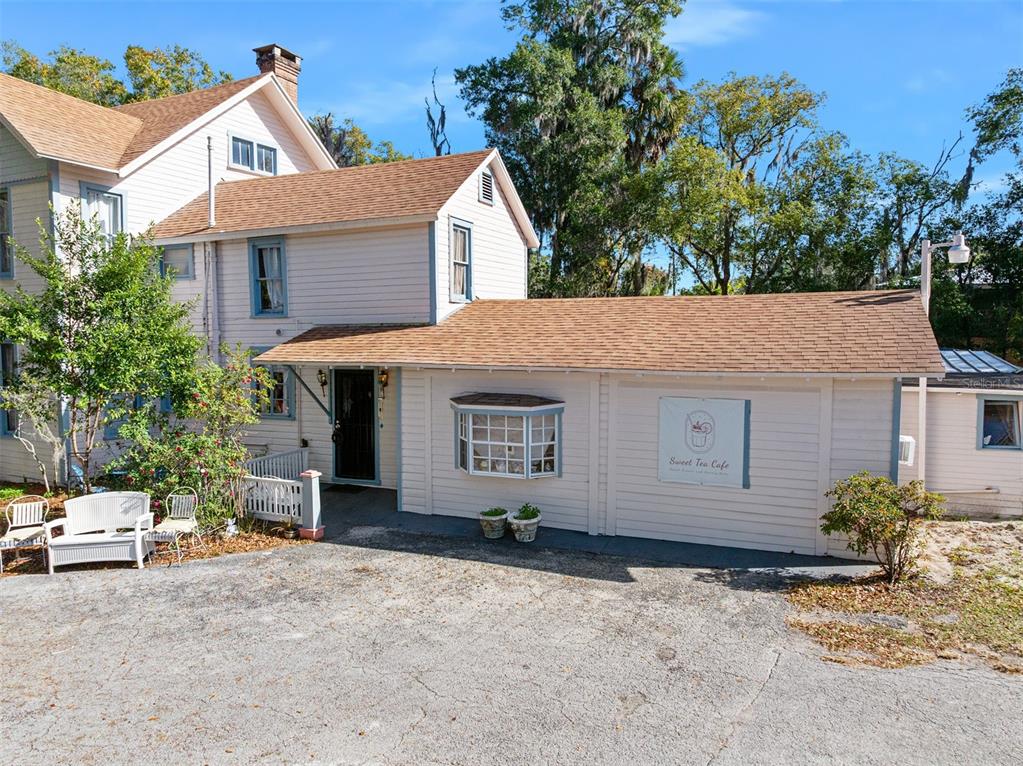 228 West Howry Avenue Deland, FL 32720 - Photo 32 of 51 a view of a house with a backyard and garage
