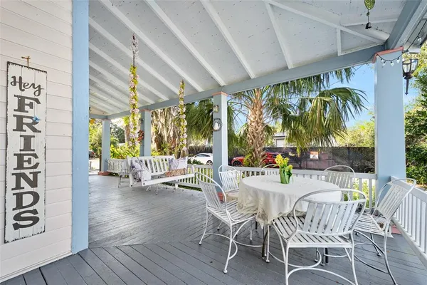 a view of a swimming pool with a patio and a yard