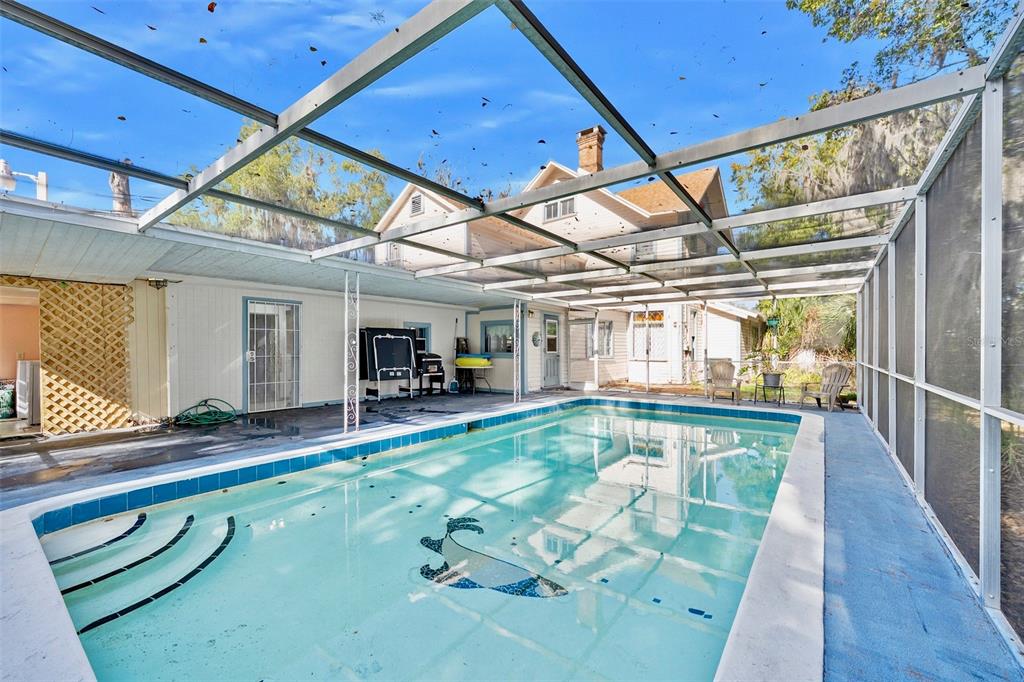 228 West Howry Avenue Deland, FL 32720 - Photo 44 of 51 a view of a porch with furniture and a yard