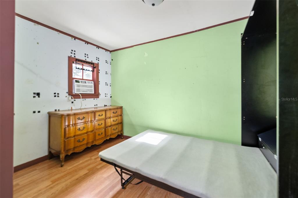 228 West Howry Avenue Deland, FL 32720 - Photo 45 of 51 a bathroom with a sink and a mirror
