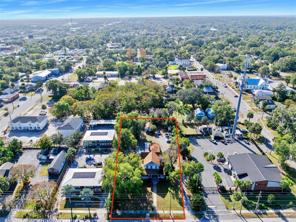 228 West Howry Avenue Deland, FL 32720 - Photo 6 of 51 an aerial view of multiple house