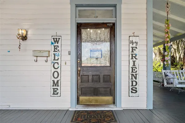 a view of an entryway door with wooden floor