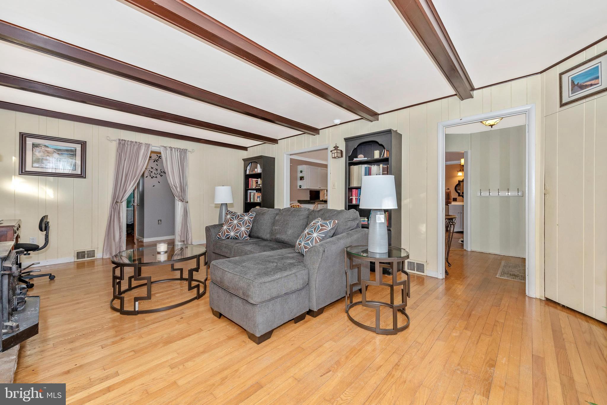 22518 Old Georgetown Road Smithsburg, MD 21783 - Photo 4 of 40 Living Room with exposed beams and hardwood floors