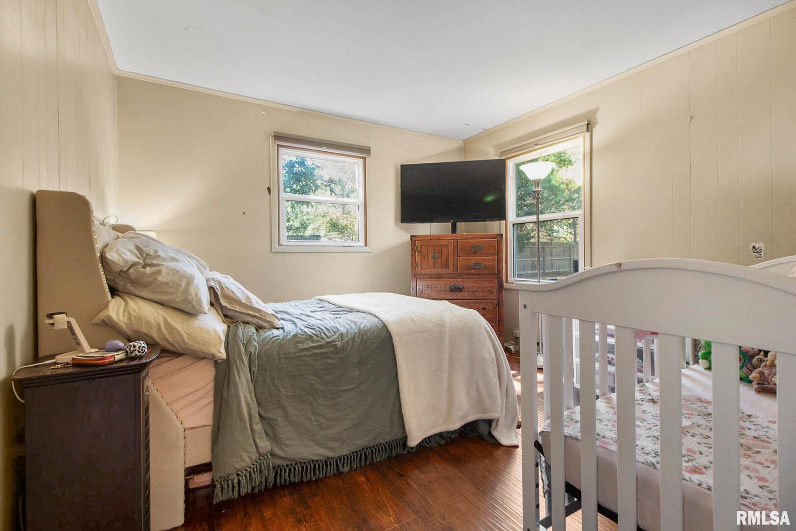 16042 Ralls Grove Road Creal Springs, IL 62922 - Photo 10 of 26 a bedroom with a bed and a flat tv screen on the dresser