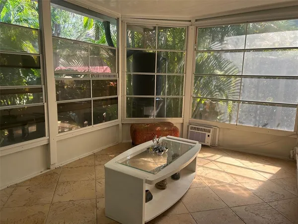 a view of a backyard with sitting area
