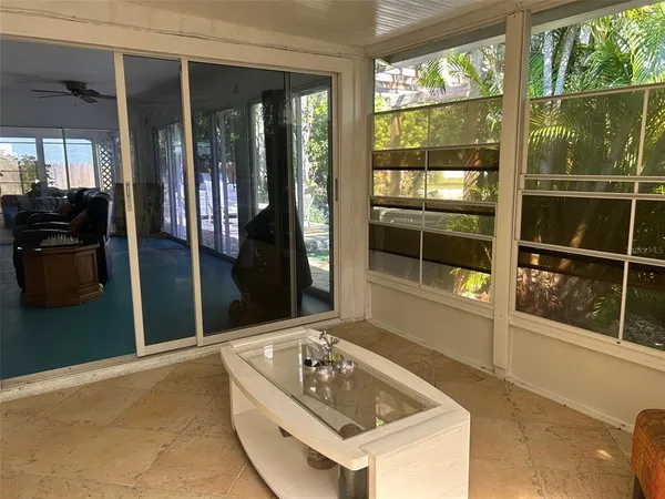 a view of a fountain in the backyard of a house