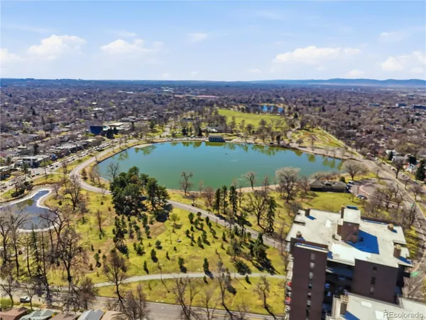 an aerial view of residential building and lake
