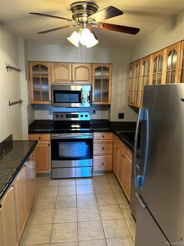 a kitchen with a stove and a microwave
