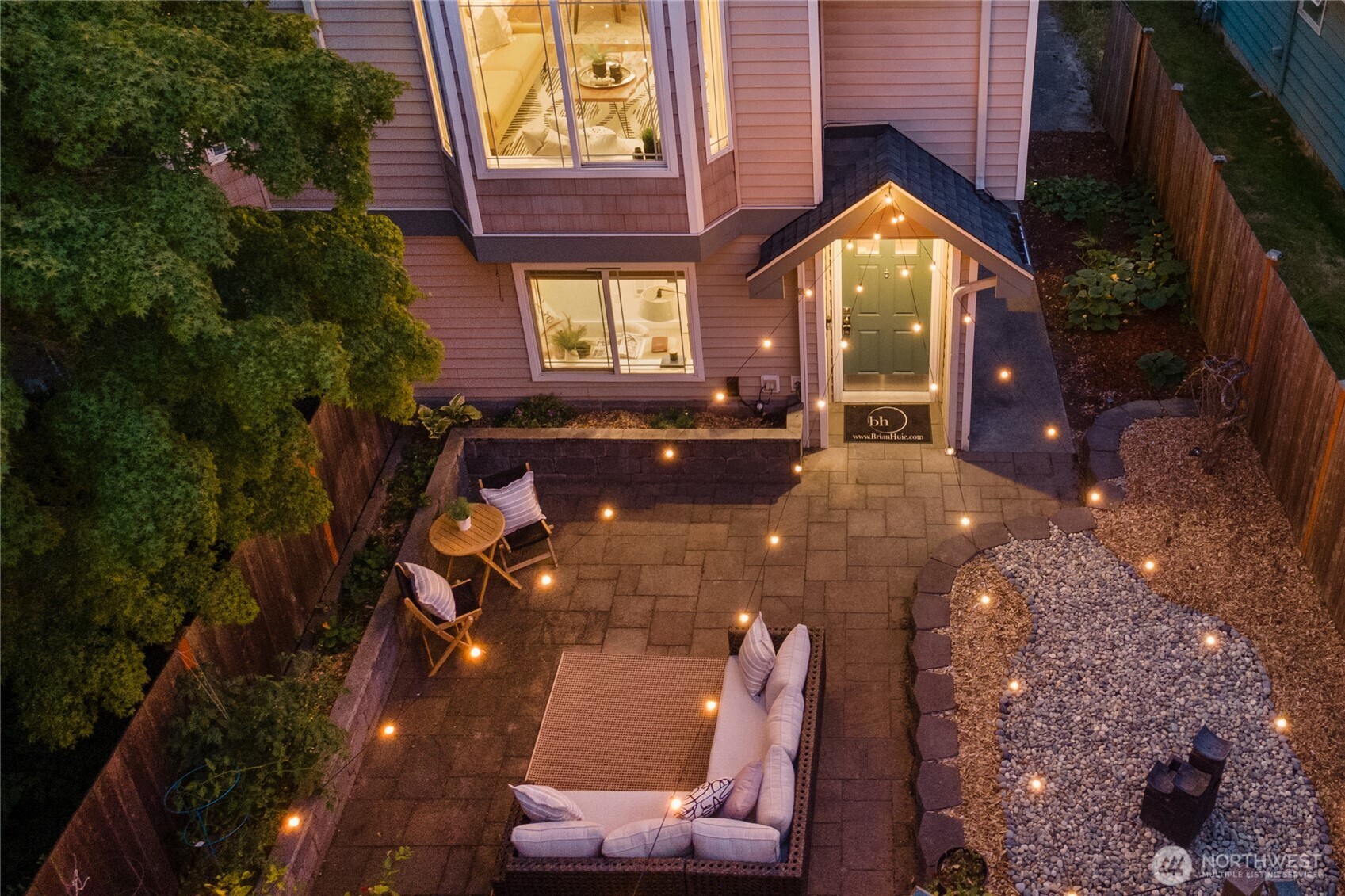 9239 Ashworth Avenue North, Unit B Seattle, WA 98103 - Photo 1 of 40 a view of a house with backyard and sitting area
