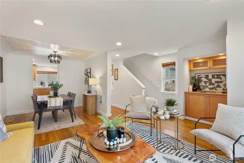 a view of a dining room with furniture window and wooden floor