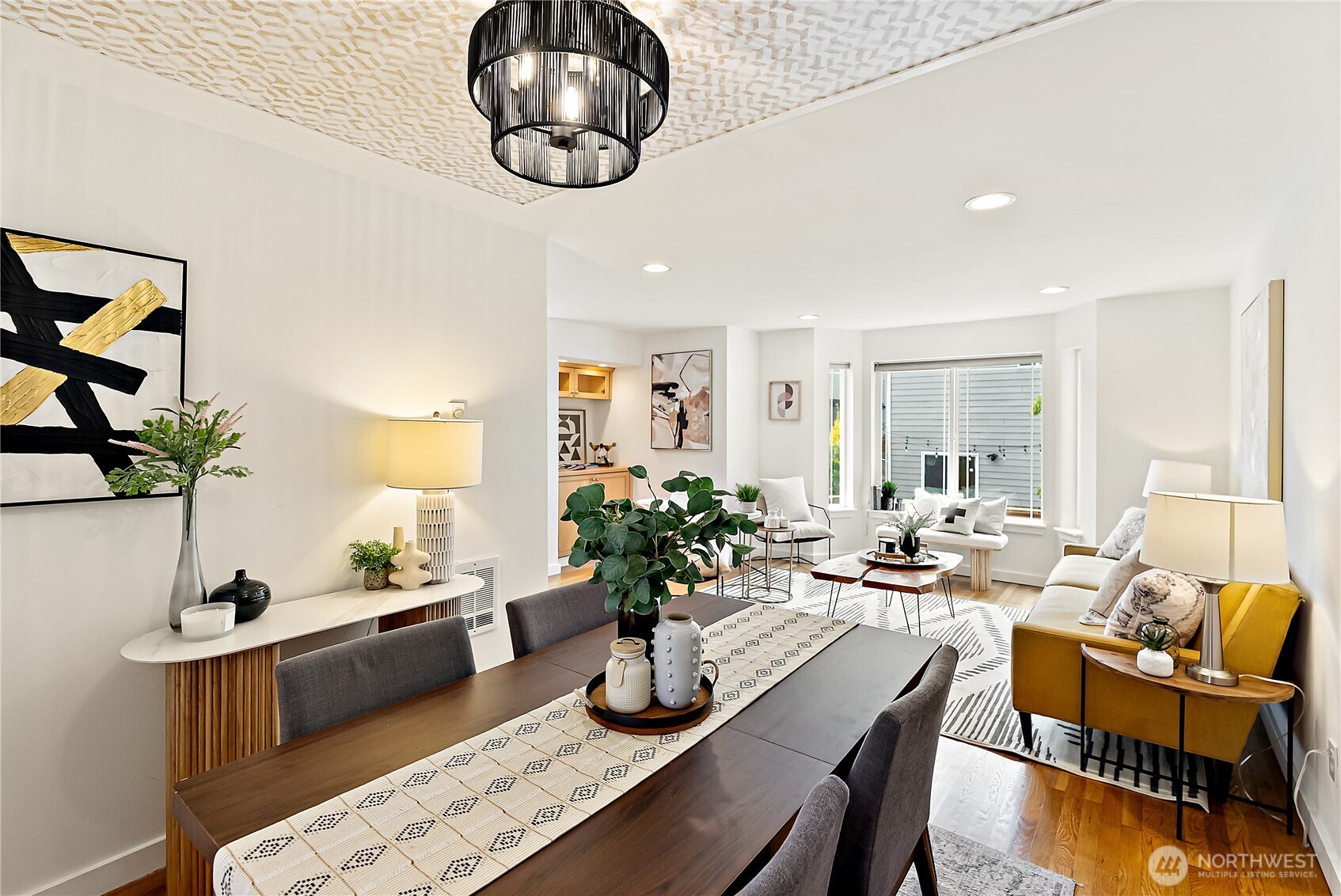 9239 Ashworth Avenue North, Unit B Seattle, WA 98103 - Photo 13 of 40 a view of a dining room with furniture window and wooden floor